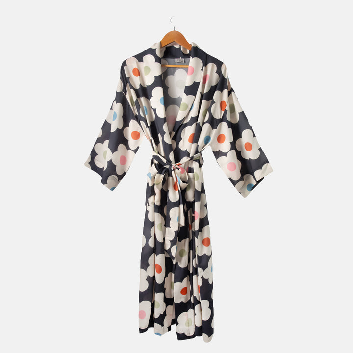 Floral patterned robe on a hanger against a white background