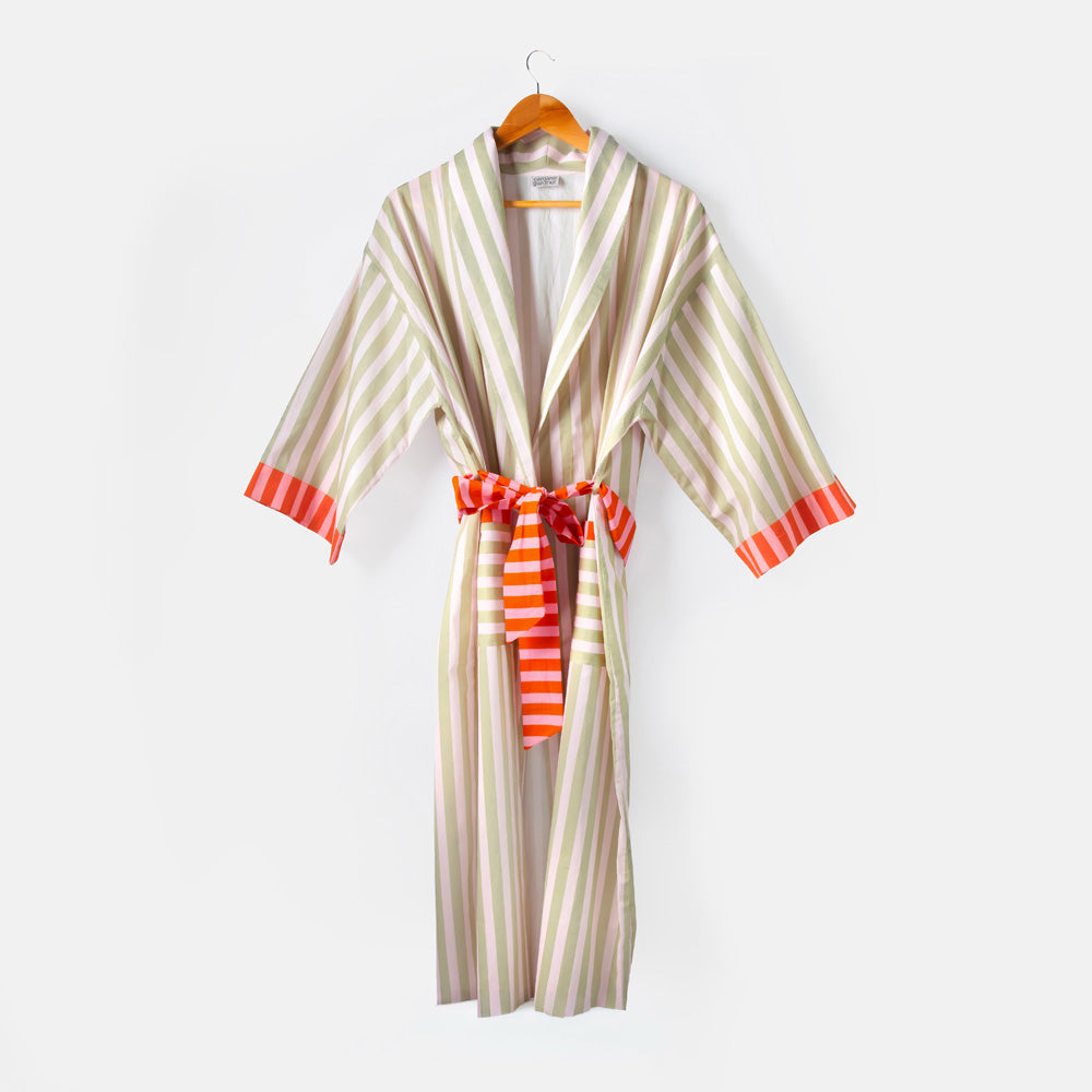 Striped robe with orange accents on a hanger against a white background