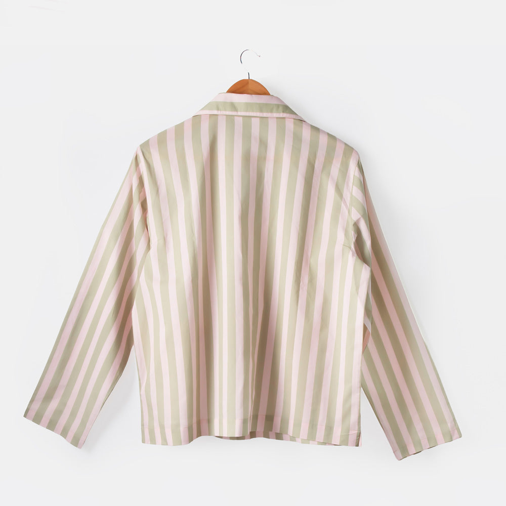 Striped shirt on a hanger against a white background