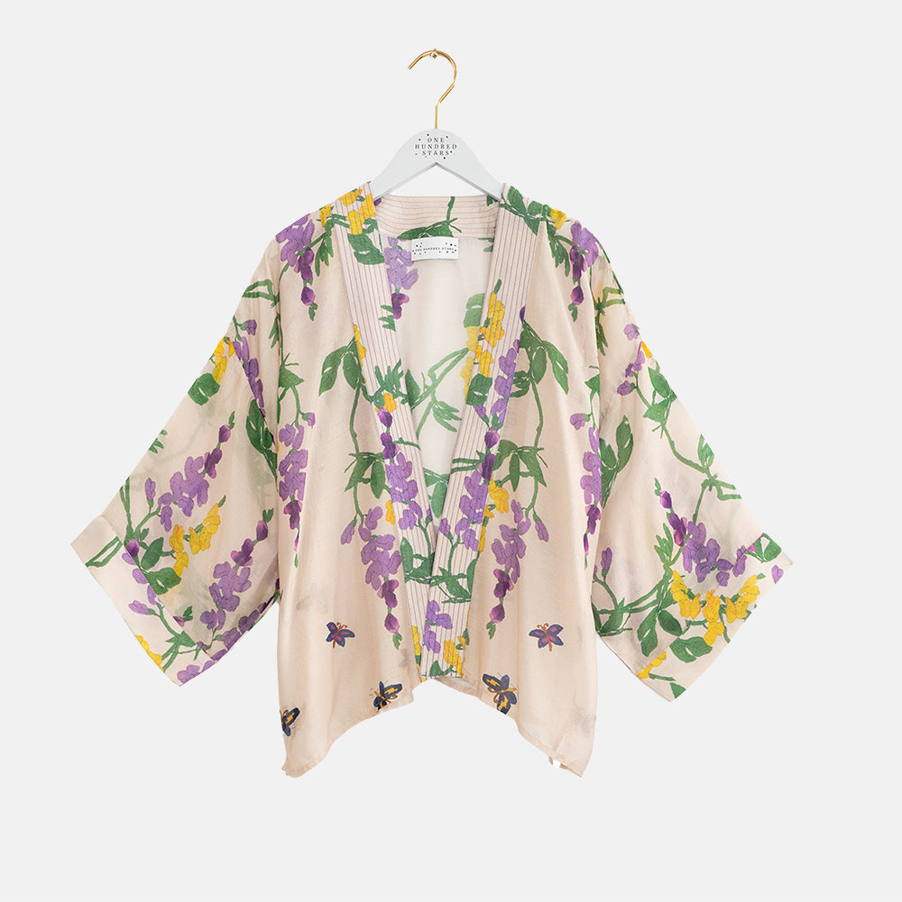 short kimono with lilac & yellow wisteria design on a stone base