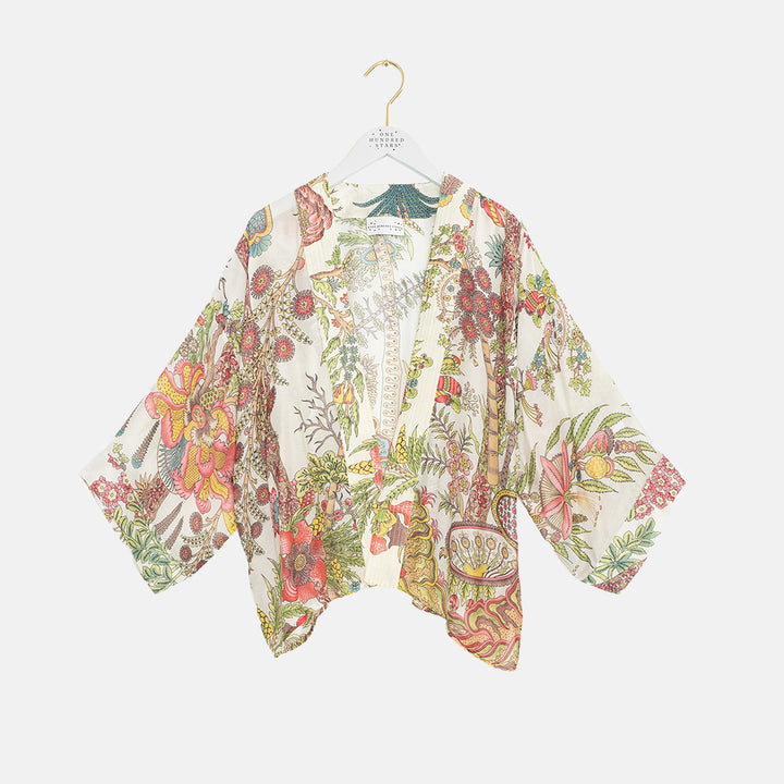 colourful floral print kimono on a coat hanger against a white background