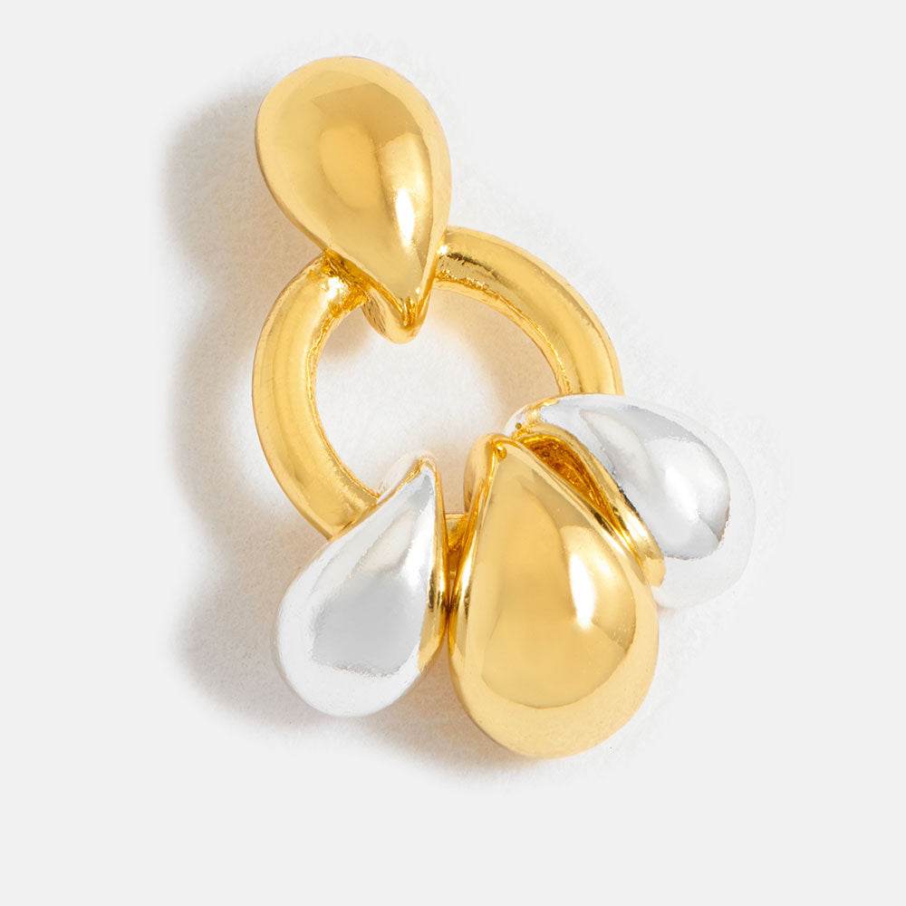 Gold and silver tiered droplet earring on a white background