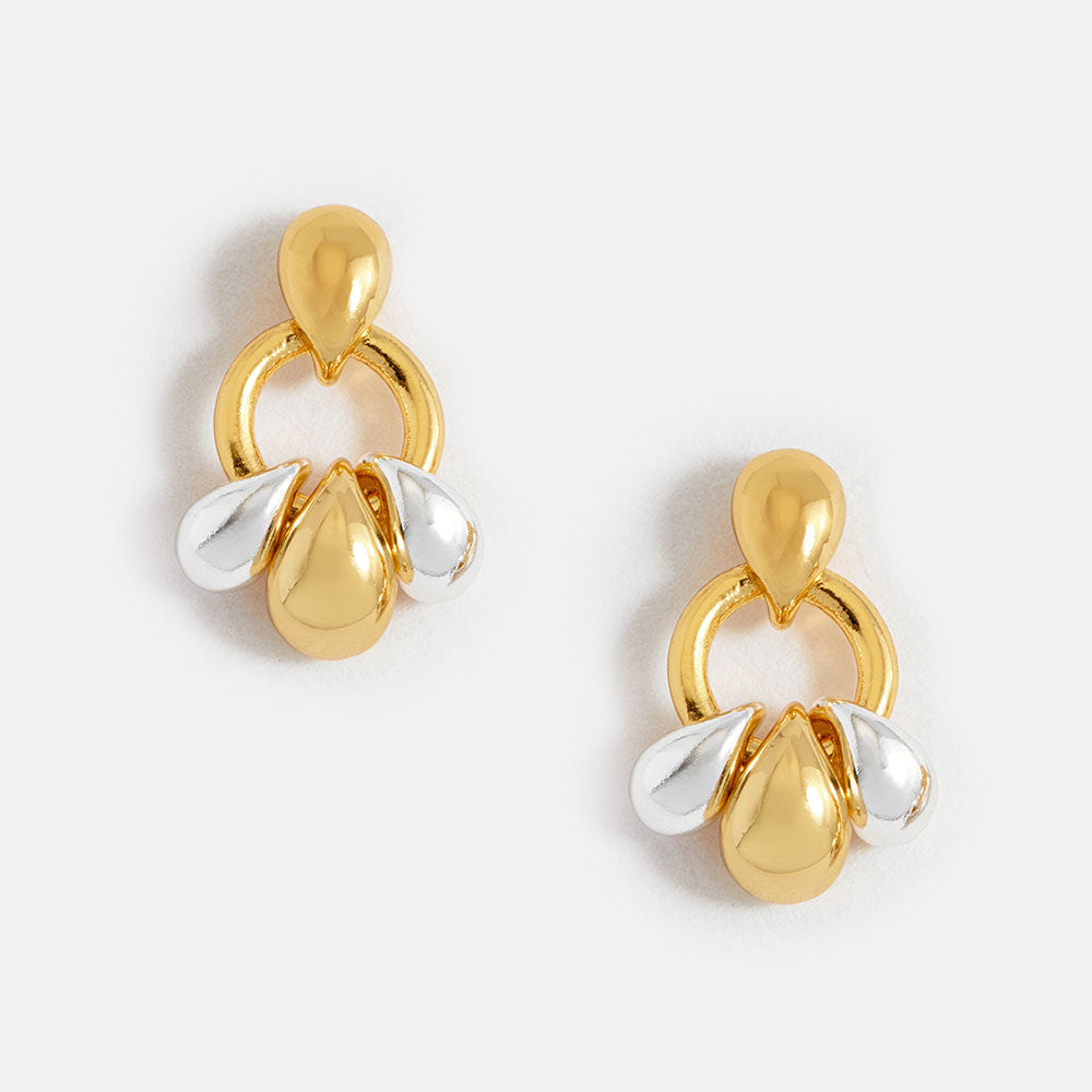 Gold and silver tiered droplet earrings on a white background