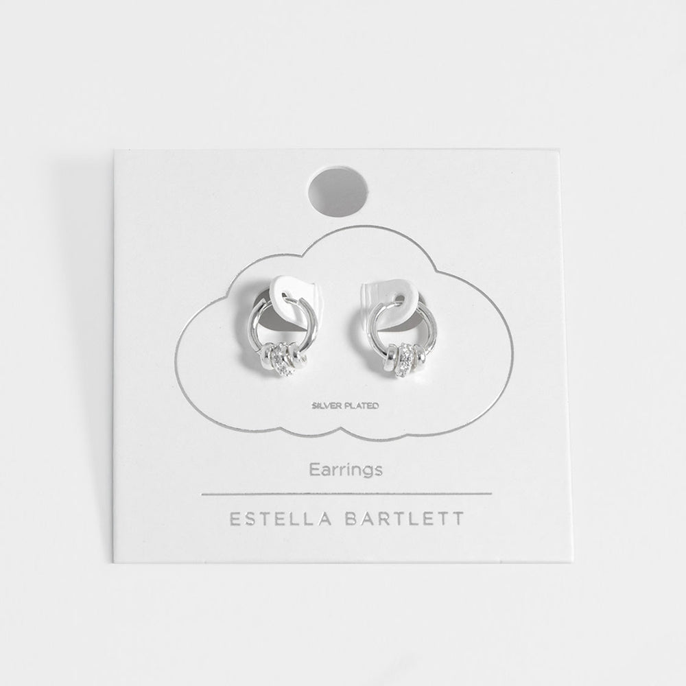 silver plated huggie hoop earrings with 3 silver discs, one with cubic zirconia