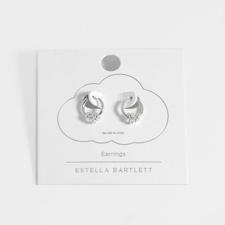 silver plated huggie hoop earrings with 3 silver discs, one with cubic zirconia