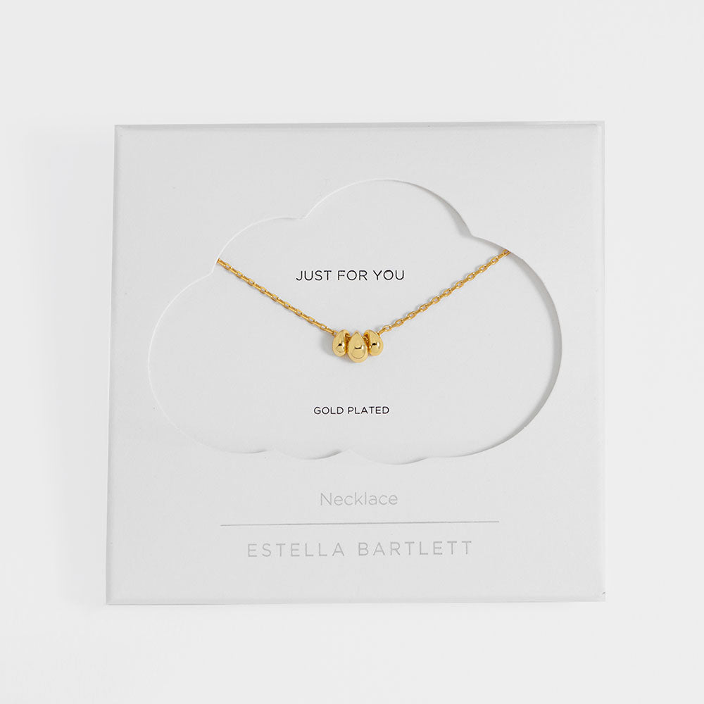 gold fine chain necklace with three gold teardrop shaped beads in 'estella bartlett' branded packaged