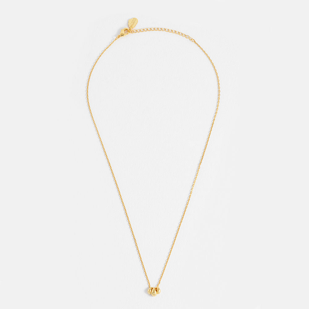 gold fine chain necklace with three gold teardrop shaped beads