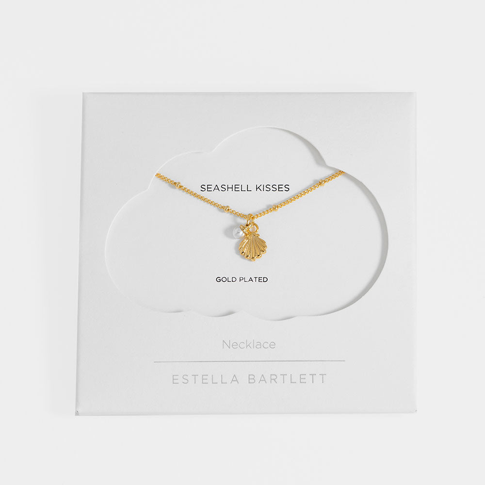 Gold-plated necklace with seashell pendant on Estella Bartlett card