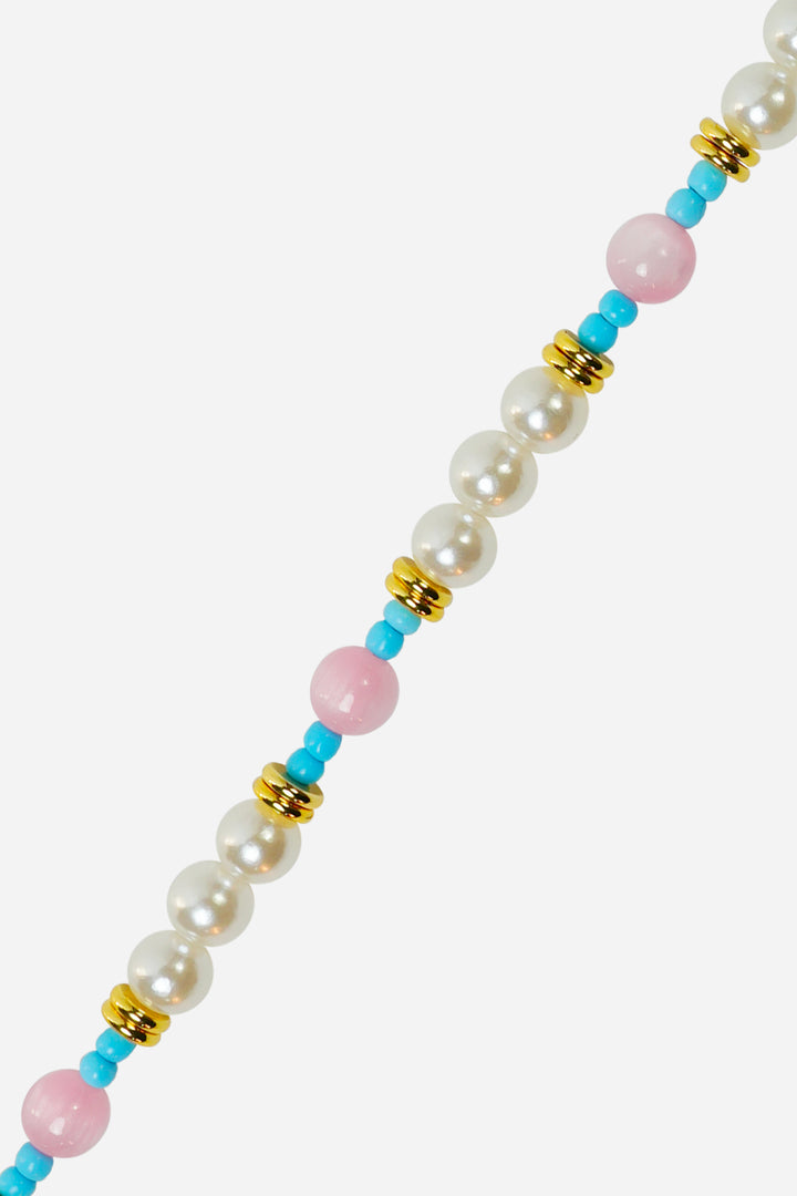 phone strap with colourful beads and a gold tag on a white background
