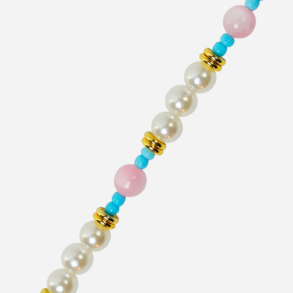long phone strap with colourful beads and a gold tag on a white background