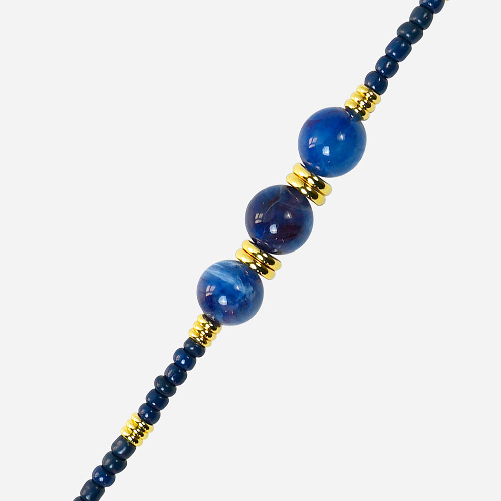 long phone chain with blue and gold beads on a white background