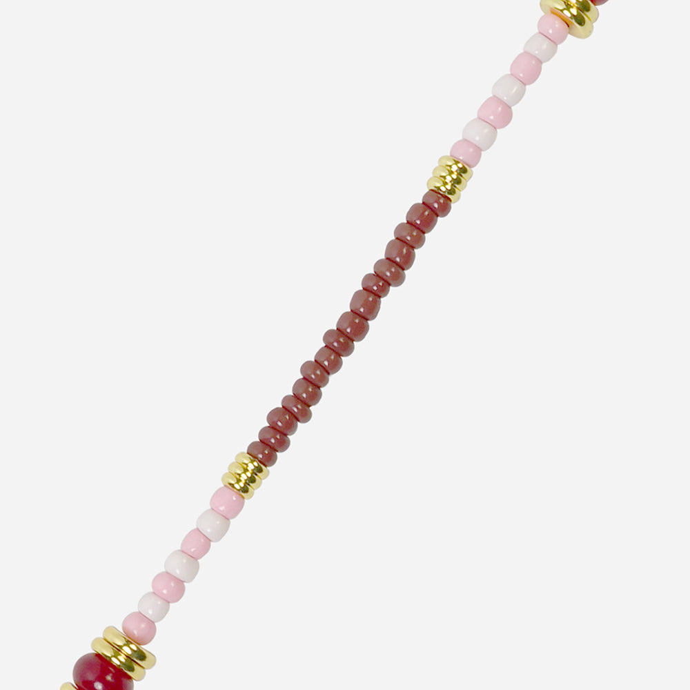beaded phone strap with red, pink, white and gold beads