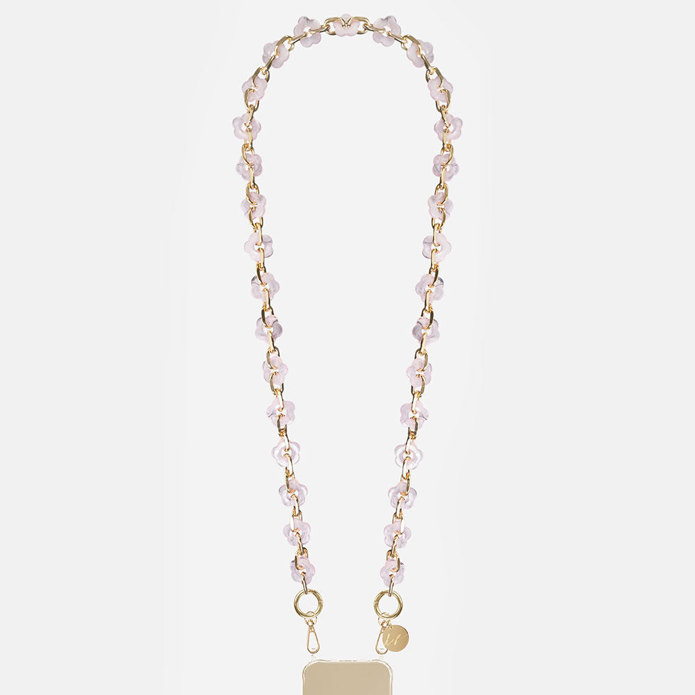 phone chain with gold chain and pink resin flowers on a light grey background