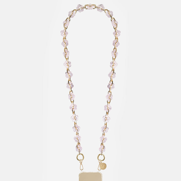 phone chain with gold chain and pink resin flowers on a light grey background