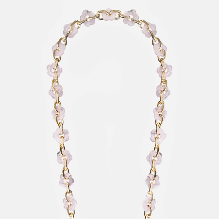 phone chain with gold chain and pink resin flowers on a light grey background