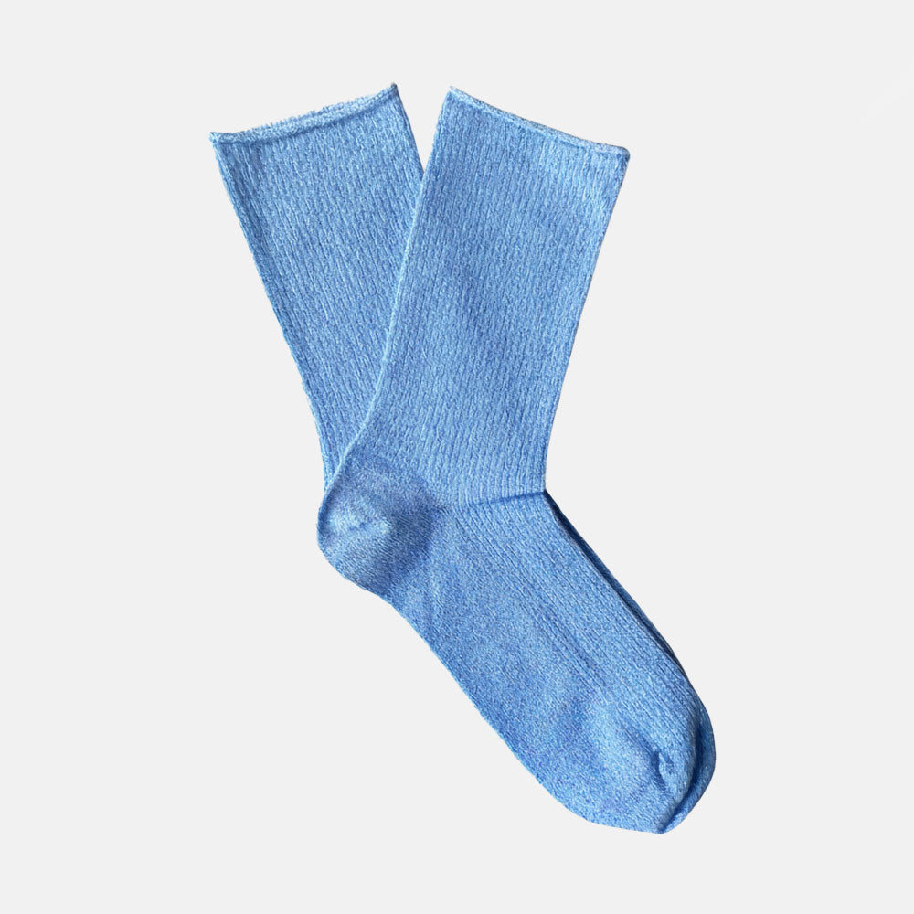 Blue sock on a light grey background
