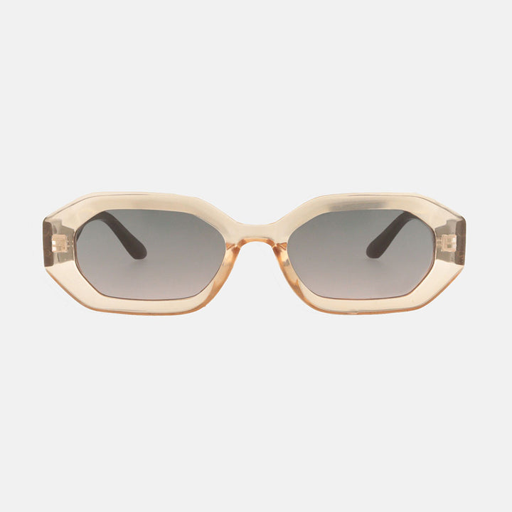 Sunglasses with a beige frame and dark lenses on a white background