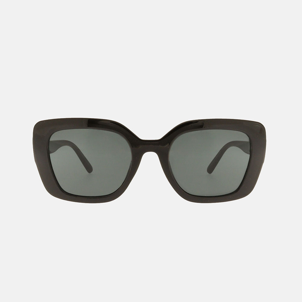 Black sunglasses with dark lenses on a light gray background