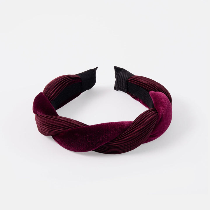 Maroon pleated twist headband on a white background