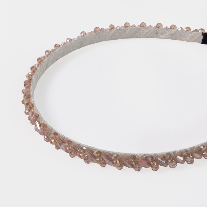 Silver headband set with crystals on a white background