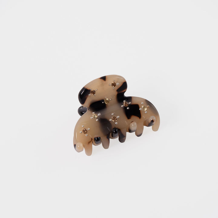 Tortoiseshell patterned hair clip set with mini crystals on a white background