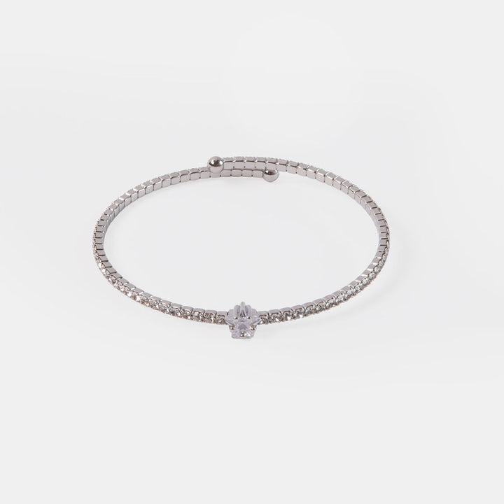 silver slim bangle set with a single row of small crystals and a central star shaped crystal 