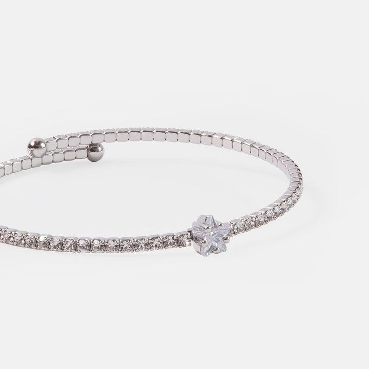 silver slim bangle set with a single row of small crystals and a central star shaped crystal 