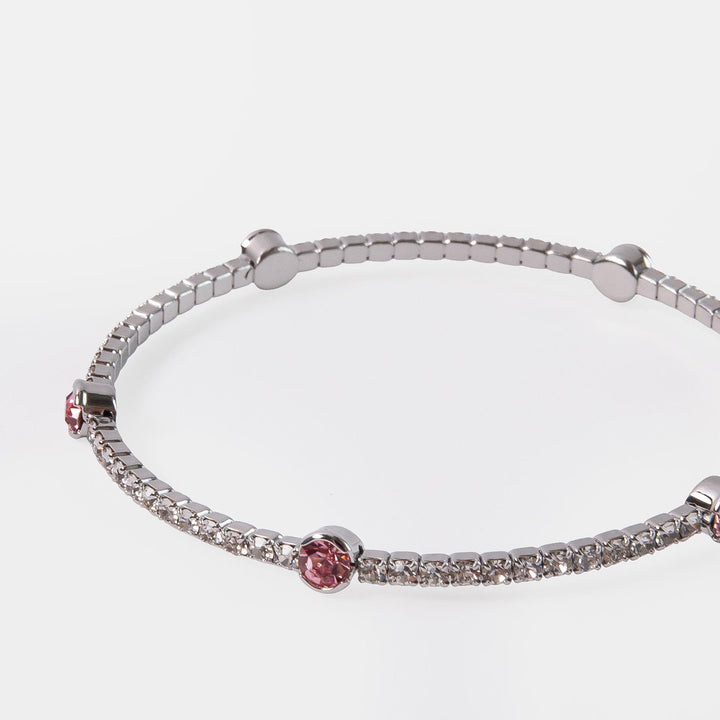 silver bangle set with small silver crystals and larger pink crystals 