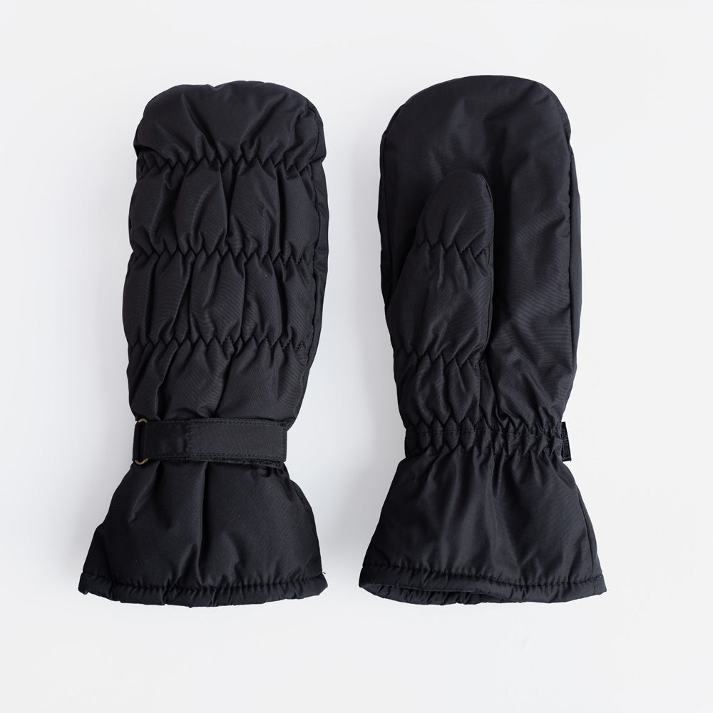 A pair of black padded mittens with a ruched, quilted finish and adjustable wrist strap, on a light grey background.