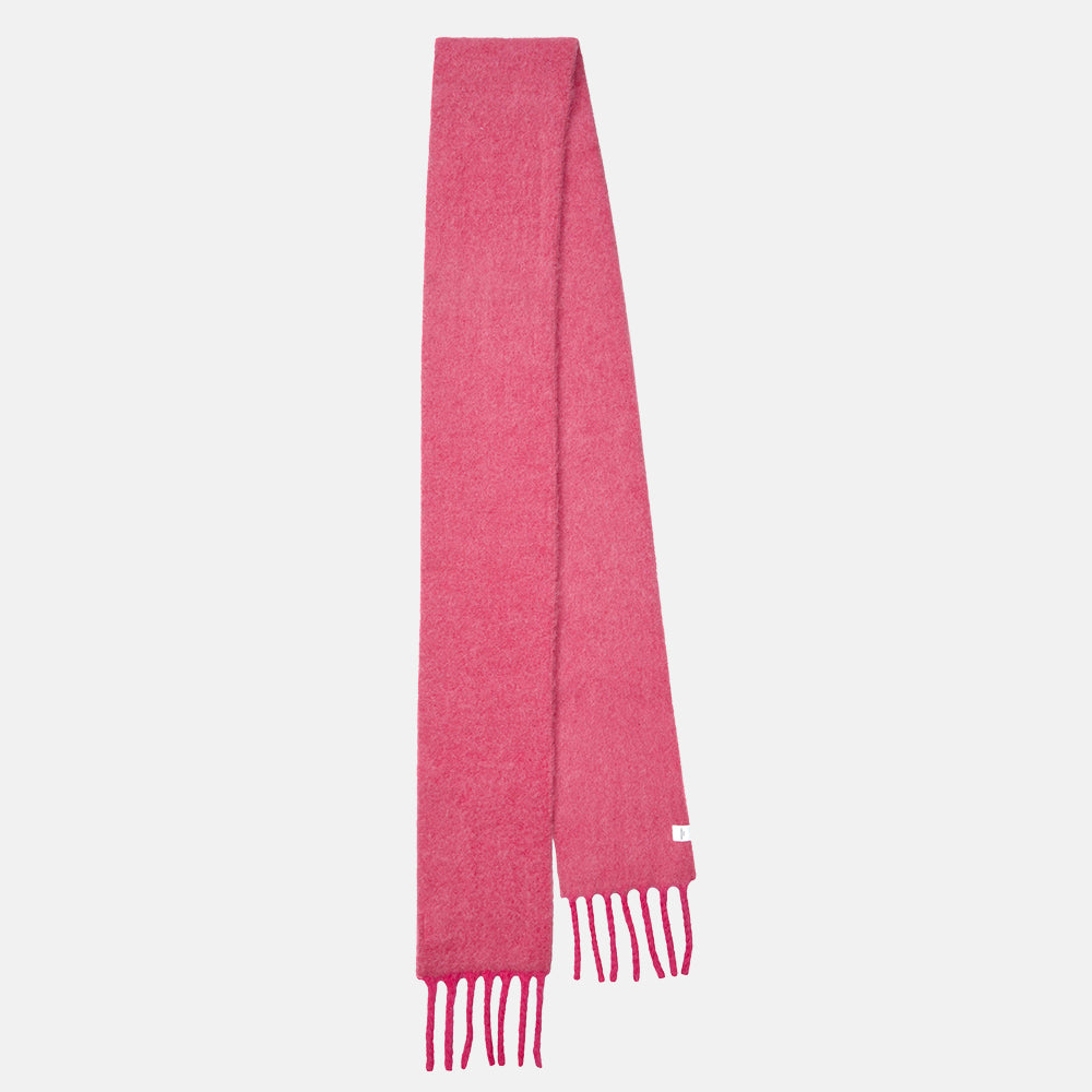 A long slim raspberry pink scarf with fringed ends hanging straight against a light grey background.