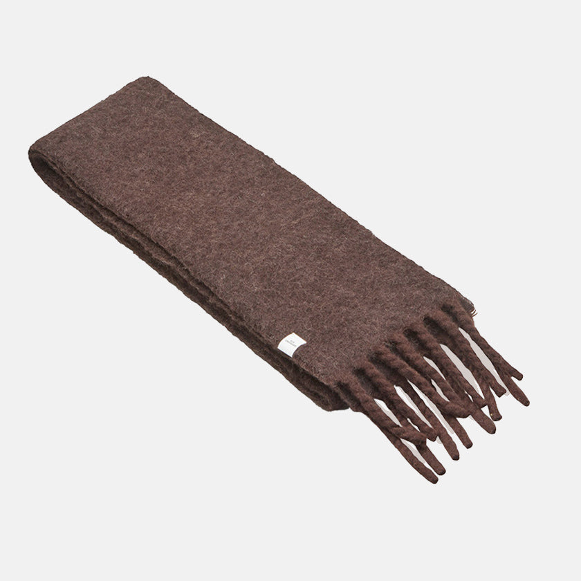 A slim, brushed chocolate brown scarf with fringed ends, laid flat on a light grey background.