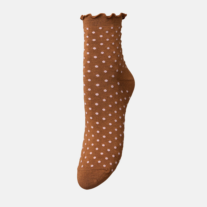 A single brown ankle sock with a pink polka dot pattern and a scalloped ruffled cuff, shown against a plain white background.