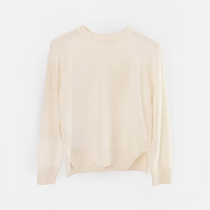 An off-white knit cardigan sweater with a mock neck, raglan sleeves, and a button-up back, displayed on a clean white background.