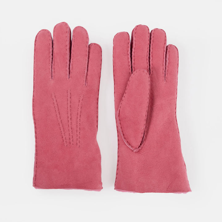 A pair of dusty rose pink leather gloves shown flat against a clean white background.