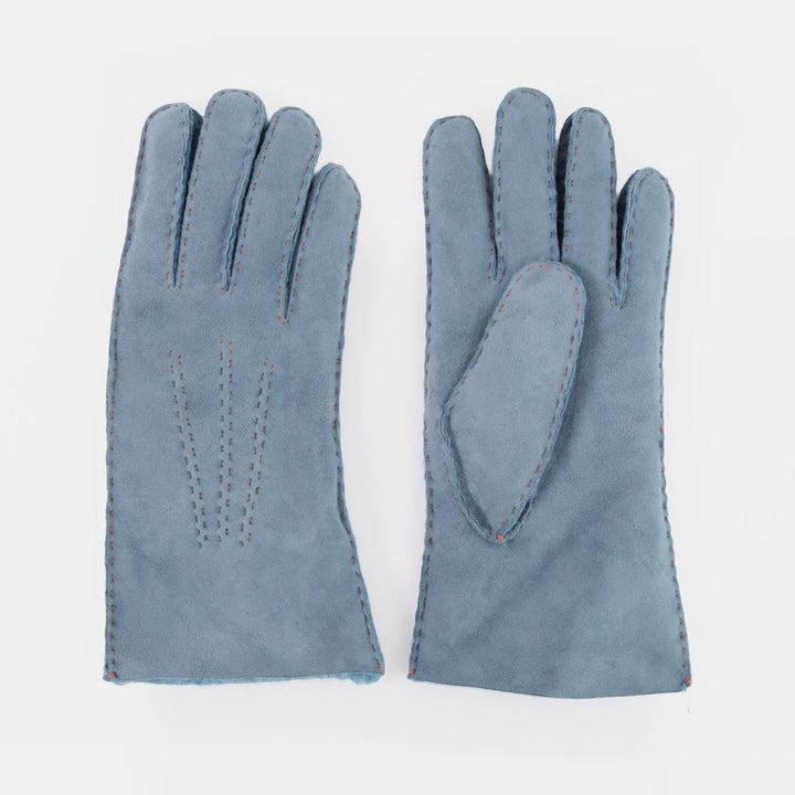 A pair of slate blue suede gloves shown flat against a clean white background, displaying both the back of one glove and the palm/thumb side of the other.