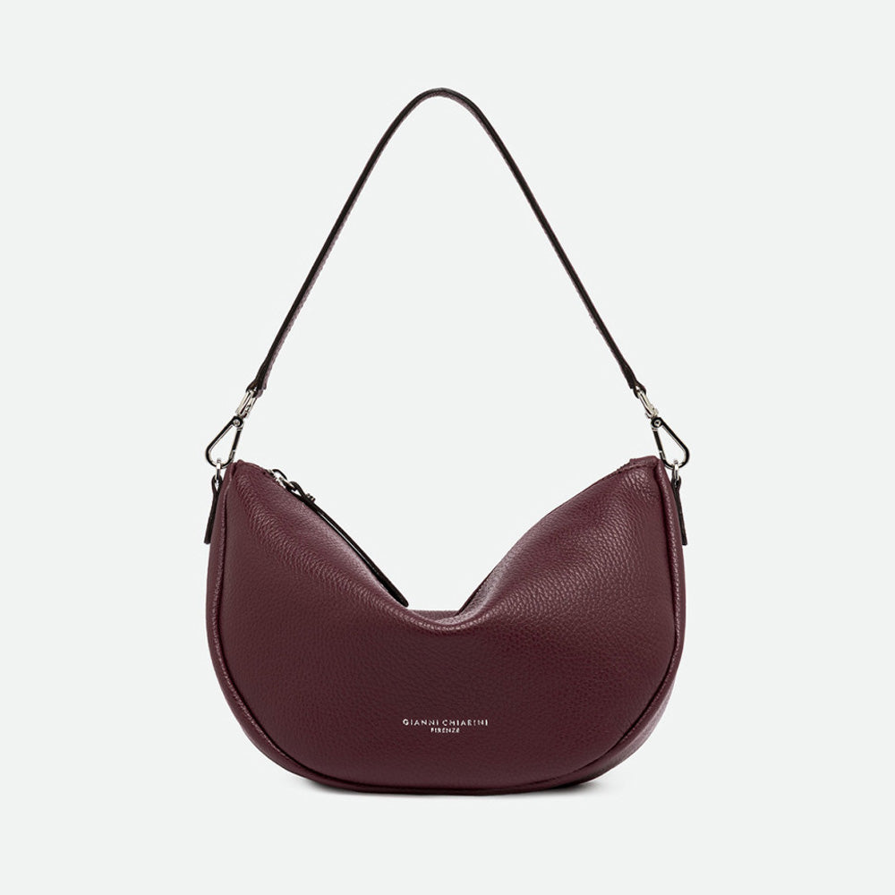 Burgundy grained leather half moon shoulder bag with a slim shoulder strap