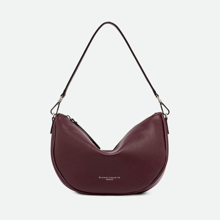 Burgundy grained leather half moon shoulder bag with a slim shoulder strap