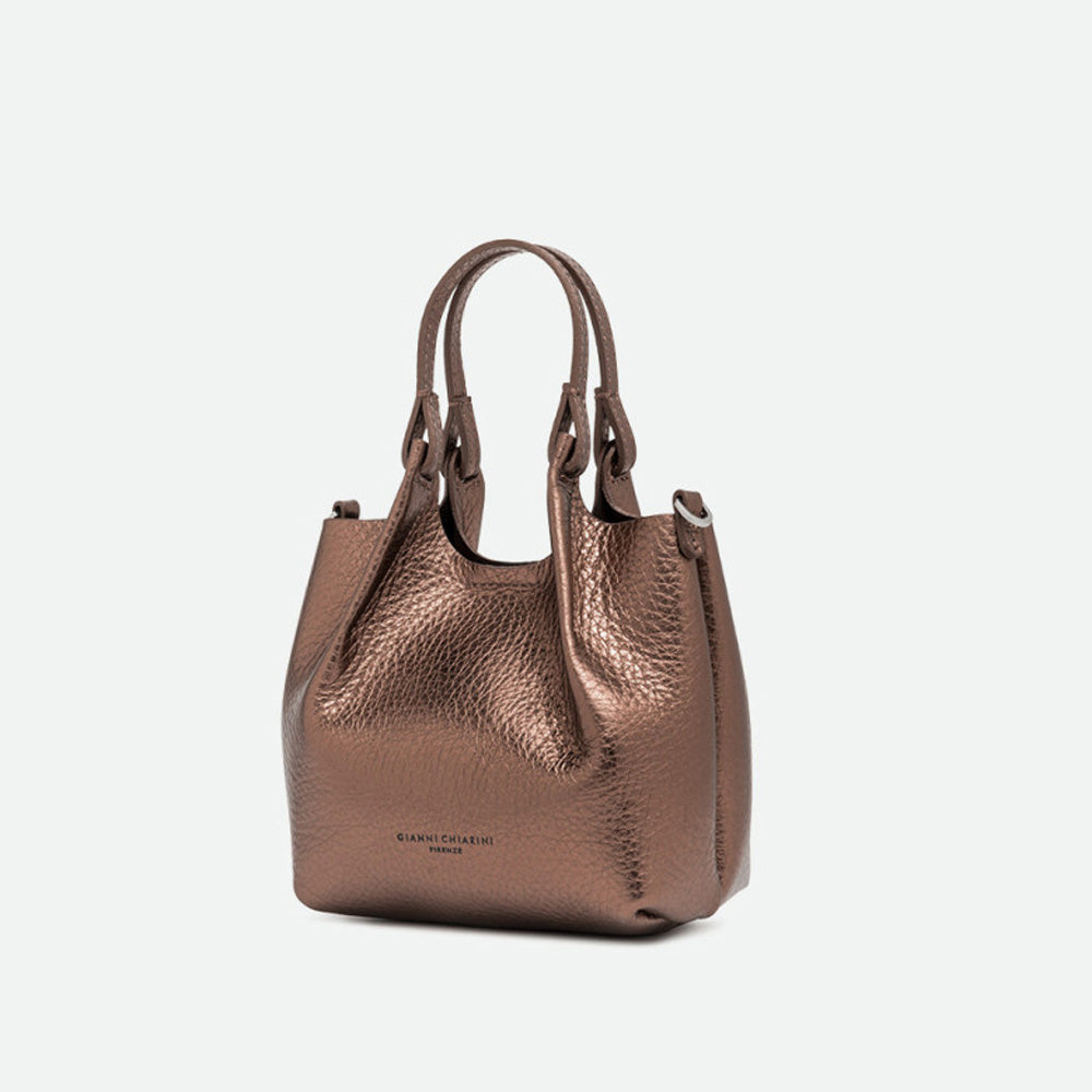 Angled view of a small bronze metallic leather tote bag