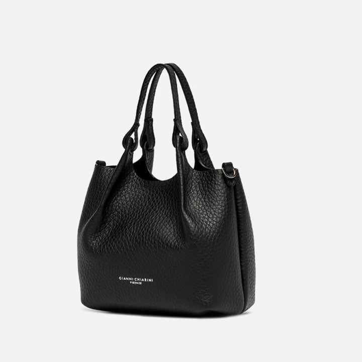 Angled view of a small black pebbled leather tote bag