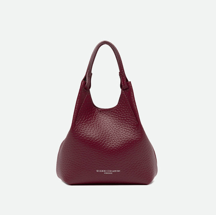 Small deep red pebbled leather tote bag with knotted handles and a slouchy shape