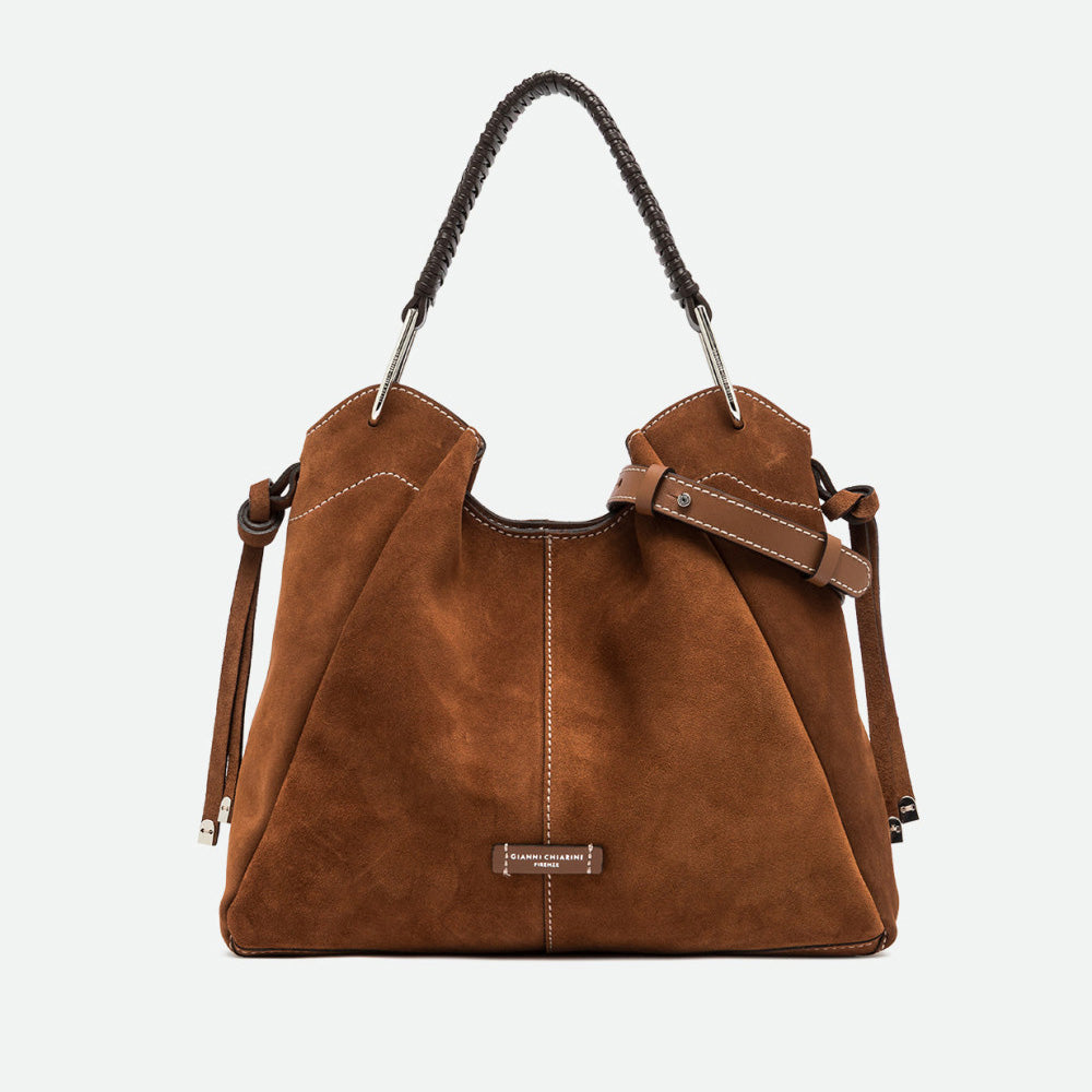 Large tan suede shoulder bag with a braided leather handle and white contrast stitching