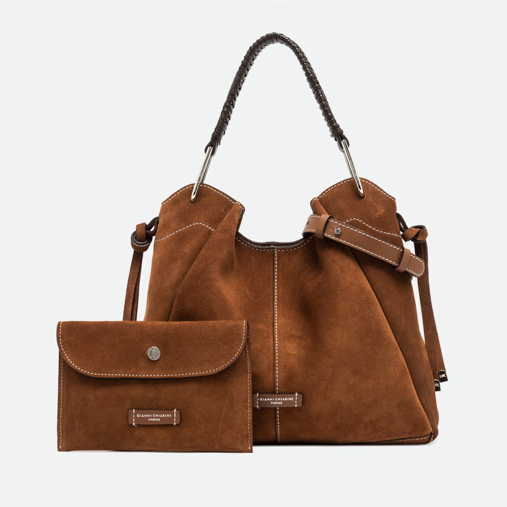 Large tan suede shoulder bag shown with a matching small suede pouch
