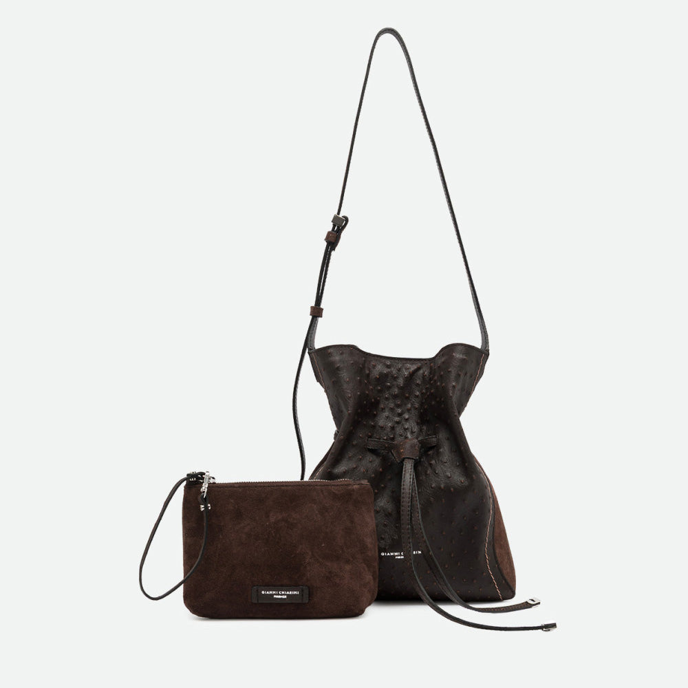 Dark brown leather bucket bag shown with a matching small suede pouch