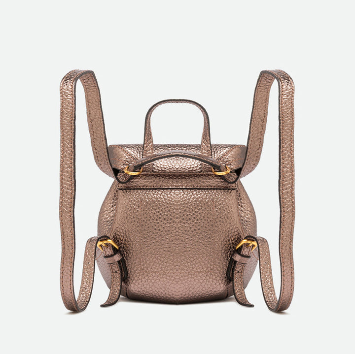 Back of a bronze metallic leather backpack showing two adjustable straps