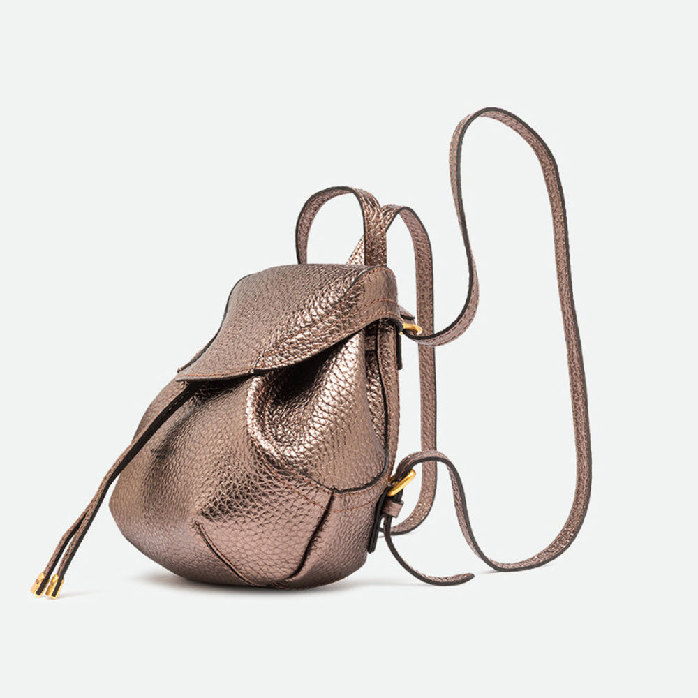 Side view of a small bronze metallic leather backpack