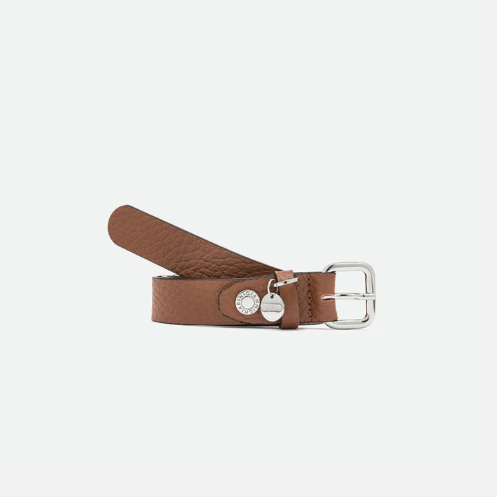 Rolled tan leather belt with a silver square buckle and round silver charm