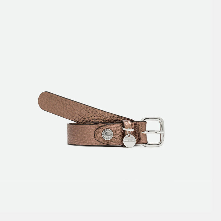 Rolled bronze metallic leather belt with a silver square buckle and round charm
