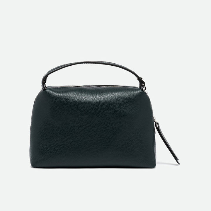 Front of a dark green leather handbag with rounded sides and a zip top
