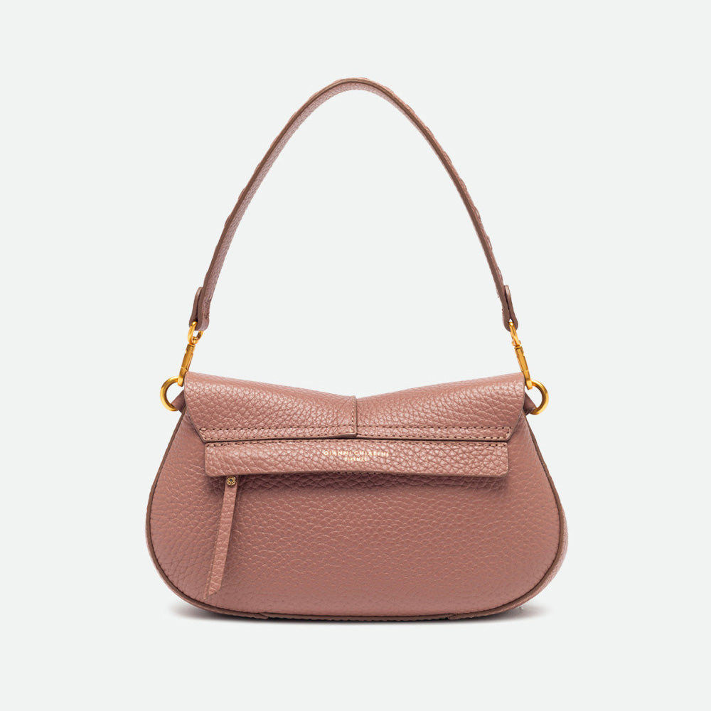 Back of a dusty pink leather shoulder bag with a curved base