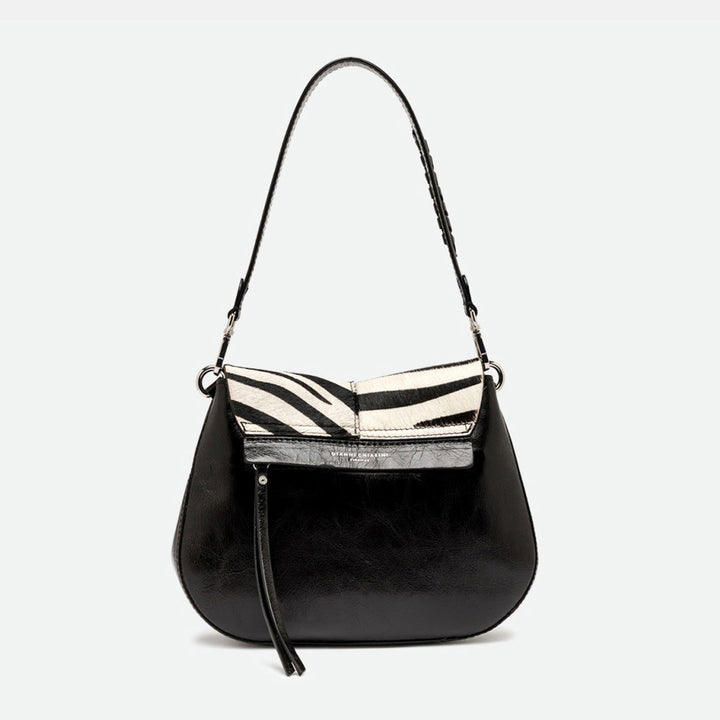 Back of a zebra print shoulder bag showing glossy black leather and a zip pocket